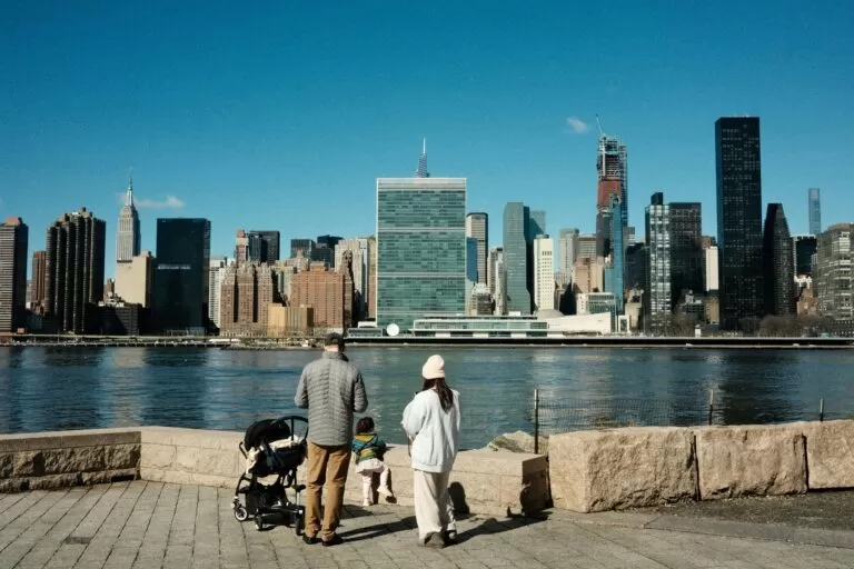 Family Looking at Skyscrapers in Skyline of New York City in USA